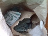 $100 Bills Thrown Onto Highway 