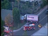 Raw Video: Truck Plows Into House