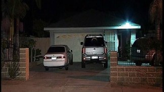 Armed Men Lock Family in Bathroom