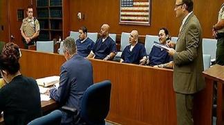 Men Smirk, Eat Candy While Receiving Sentence