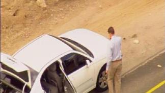 Raw Video: Officers Investigate I-805 Suspect Vehicle
