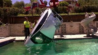 Woman in Critical Condition After Driving into Pool