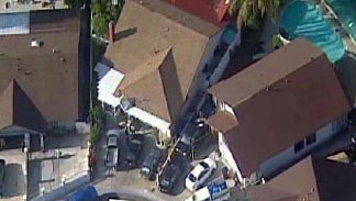 Images: Bodies Found in Backyard of Bay Terraces Home
