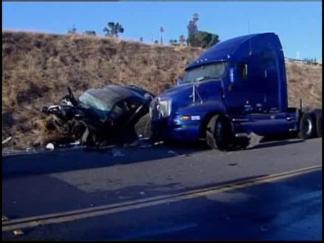 Car Flies Off Highway Into Parked Semi
