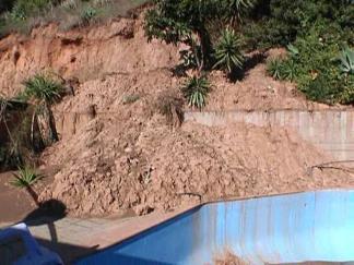 Property Collapses into Neighbor's Yard