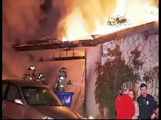 Neighbors, Cops Rescue Woman From Fire