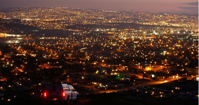 A border patrol vehicle in the US overlooks the lights of Tijuana, Mexico. A border patrol vehicle in the US overlooks the lights of Tijuana, Mexico.