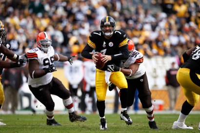 QB Ben Roethlisberger of the Pittsburgh Steelers tries to escape the grasp of David Bowens #96 of the Cleveland Browns.