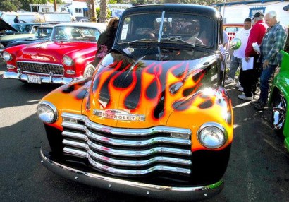 Visitors to the 22nd annual Burger Run Car Show at Pepper Tree Frosty in Vista stop to admire an early 1950's Chevy truck, one of more than 400 vehicles on display. Visitors to the 22nd annual Burger Run Car Show at Pepper Tree Frosty in Vista stop to admire an early 1950's Chevy truck, one of more than 400 vehicles on display.