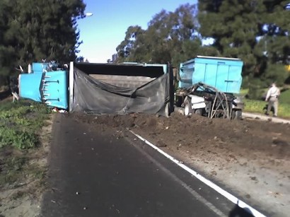 A wrong-way crash caused a dump-truck hauling a trailer to flip and injured at least two people. A wrong-way crash caused a dump-truck hauling a trailer to flip and injured at least two people.