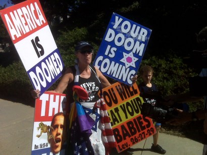 This woman and child were seen protesting on Oberlin Drive in Sorrento Valley. This woman and child were seen protesting on Oberlin Drive in Sorrento Valley.