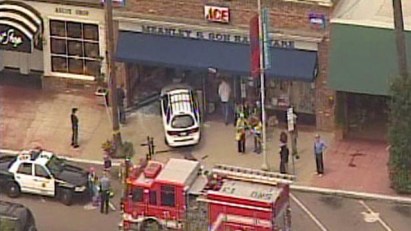 Celeb Fashion Designer Drives Car Into Store