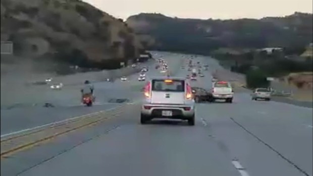 Road Rage: Motorcyclist Kicks Sedan, Sparks Crash