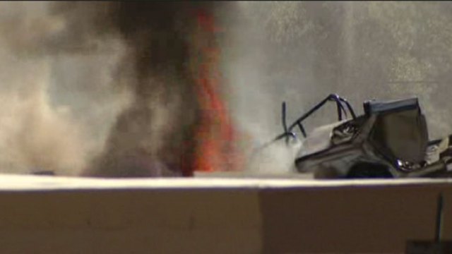 Junkyard Fire Burning Near Propane Tanks