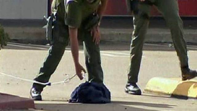 Suspect Leaves Behind Bags in Bank Holdup: Images