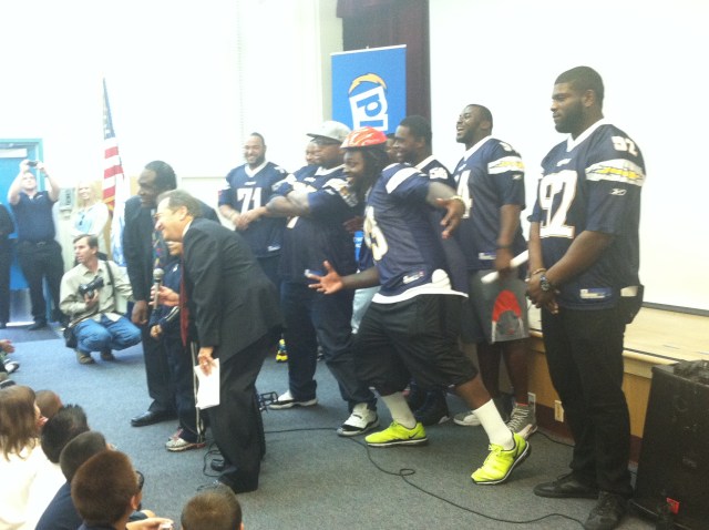 Chargers Surprise Students with 200 Bikes