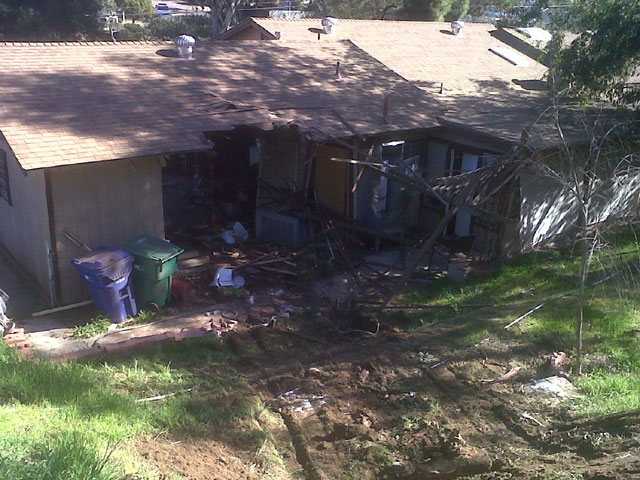 Crews Struggle to Remove Cement Truck from Home