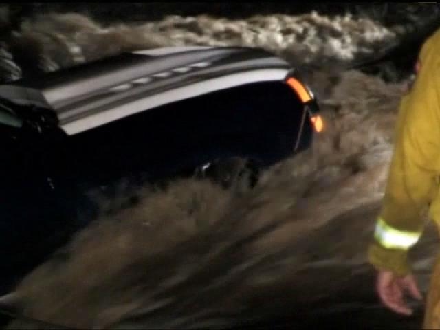 Couple Rescued from Rising Water