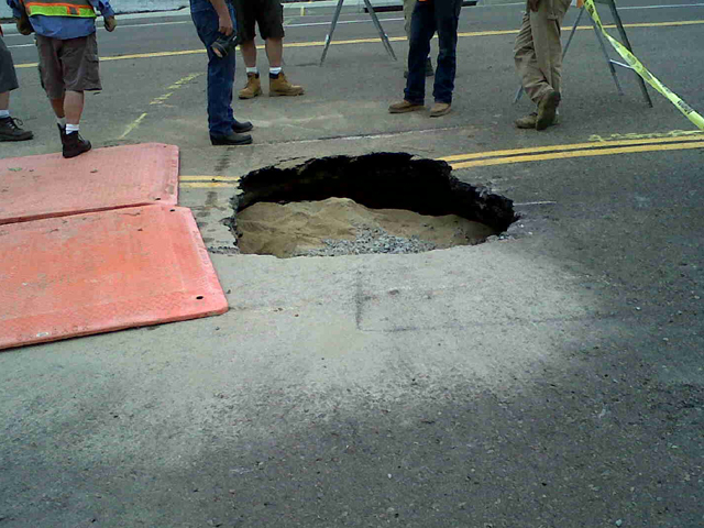 Sinkhole Caused by Cracked Storm Drain