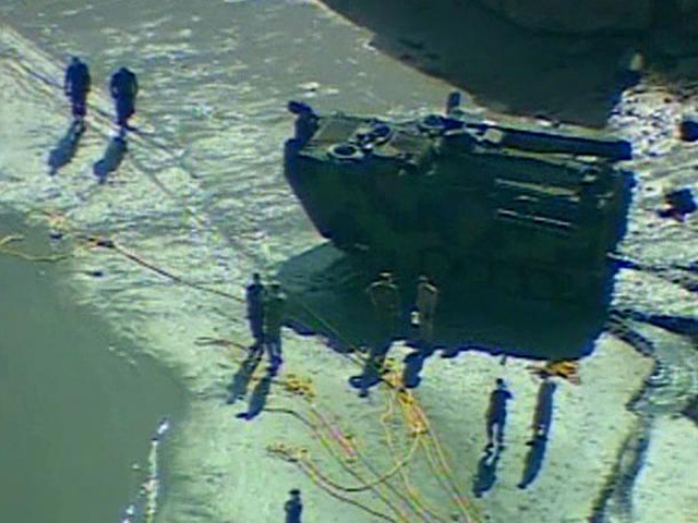 Divers Search for Submerged Military Vehicle