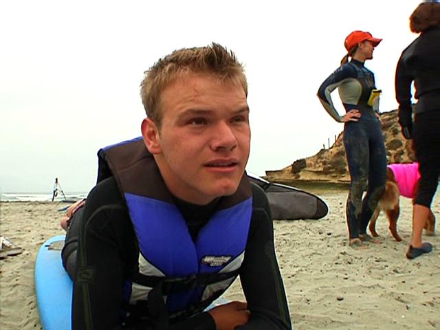 Dog and Adaptive Surfer Team Up