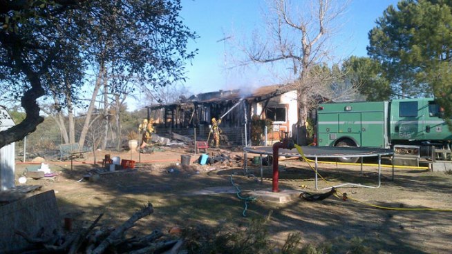 The home's contents hampered the fire sprinkler system when fire broke out Tuesday morning along Big Cat Trail in Alpine. NBC 7's Megan Tevrizian reports.