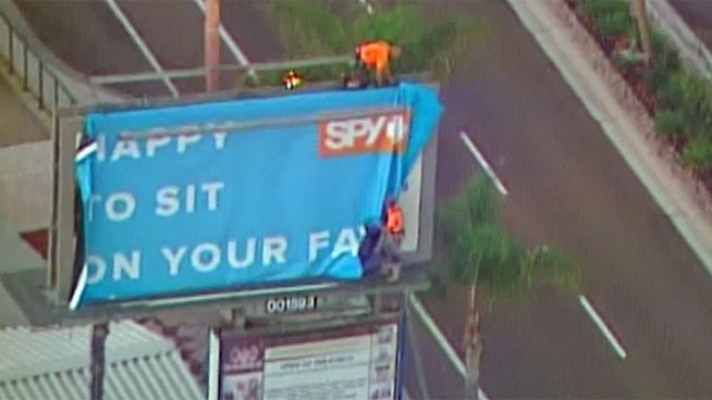 Workers removed a controversial billboard from its location near Encinitas Boulevard Thursday morning. The billboard by sunglasses company Spy said 