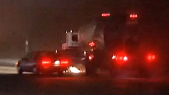 GRAPHIC VIDEO: A news photographer captured the collision between a tandem cement truck and several smaller vehicles on Interstate 805 east of San Diego Friday. One person was injured.