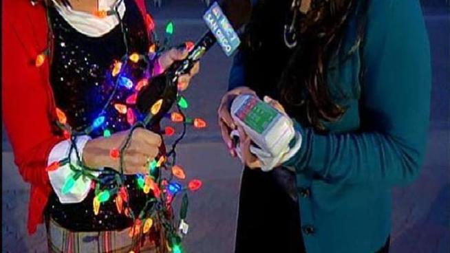 Megan at Balboa Park on the first day of December Nights learns about cost cutting and energy saving with SDGE's light exchange program.