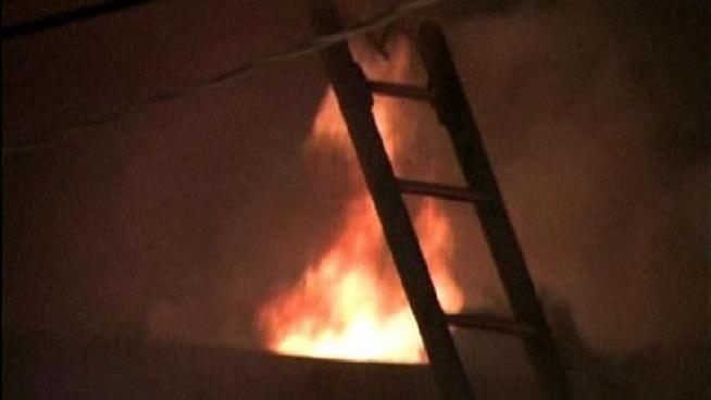 A resident of the house reported the fire when she returned home from work to find the house engulfed in flames. She managed to wake up the six other adults and one baby and evacuate them from the house before anyone was injured.