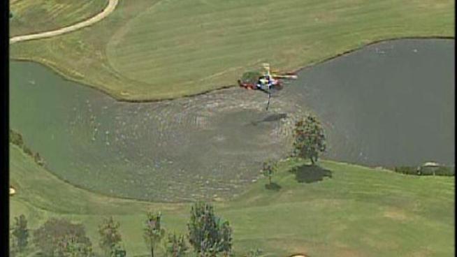San Diego firefighters battled a fire in the middle of Mission Valley Tuesday. When one of its fire helicopter needed water to help in the fight, it drew from the water hazard at a nearby golf course.