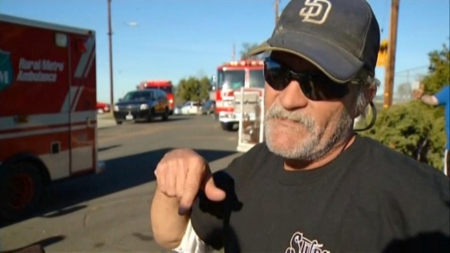 A janitor working at a Clairemont school and a neighbor saved the lives of a man and his two dogs Thursday morning.