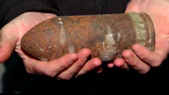 A woman working in the garden of her new home at Saratoga Avenue and Santa Barbara in Ocean Beach discovered a 75-millimeter artillery shell and called 911. NBC 7's Catherine Garcia reports.
