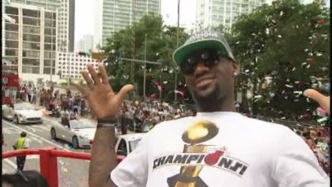While the other members of the Big Three rode up front in a bus that had the championship trophy Monday, LeBron James stayed back on his own bus, soaking in the love from fans. He said the moment was a dream come true for him.