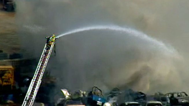 A car junkyard burned in Flinn Springs in San Diego's East County on Monday, according to fire officials.