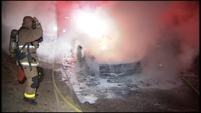 Video shows the man searching for any victims in the car before firefighters showed up to extinguish the flames.