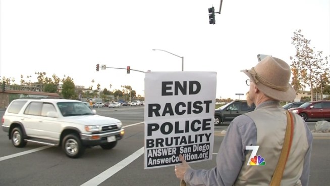 More than 50 people in the North County Coalition of Concerned Citizens, waved signs  and chanted to protest the beating of a man with Down's Syndrome.