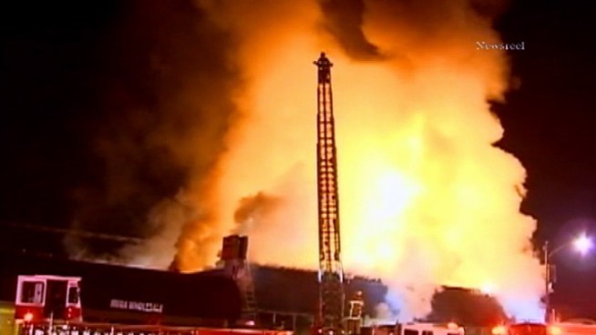 A building that houses tobacco products and other items burned early Friday in Burbank. Part of the building's facade collapsed during the fire. Raw Video