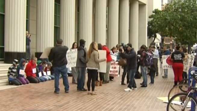 Family and supporters of Victor Ortega demonstrated outside the Hall of Justice Wednesday.