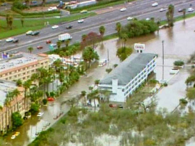 An aerial view of a hotel where up to 40 people were trapped by flood water after a series of powerful winter storms in December 2010. The highway in the video is Interstate 8.