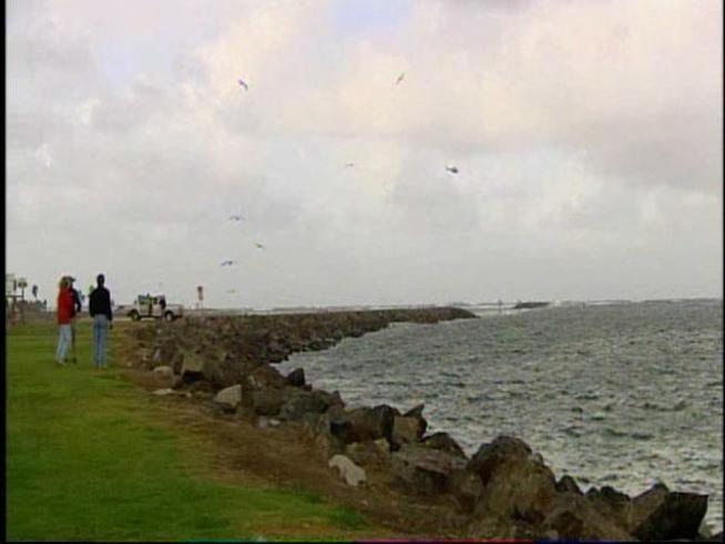 Two people were sent to the hospital after being washed off a fishing boat in Mission Bay