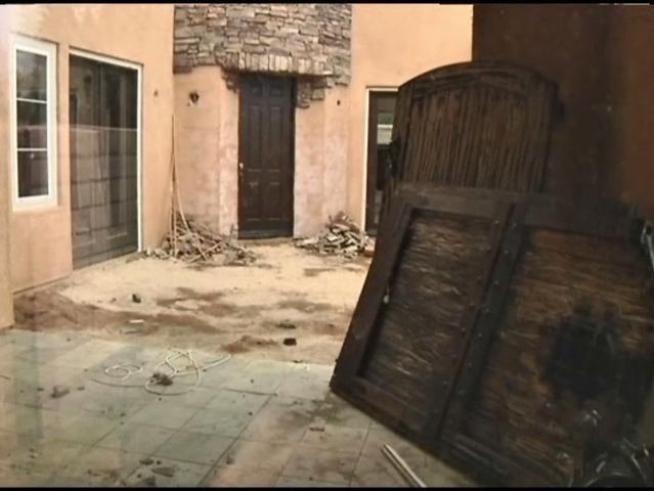 The attorney for a police officer and his wife who are accused of trashing their million-dollar home when they lost it to foreclosure says the suspects will turn themselves in on Wednesday.