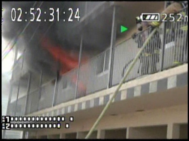 A resident ran outside his apartment and started recording the battle to contain a fire to one apartment unit in <a title=