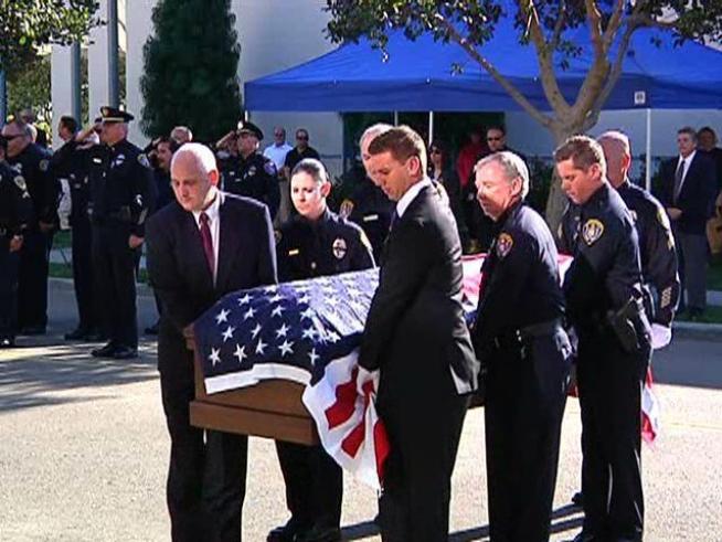 A compilation of the sights and sounds of the funeral procession and service for slain <a title=