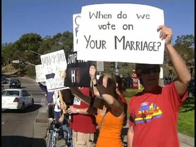 More than 100 University of California, San Diego students walked off campus in protest of the passage of proposition 8 Friday.
