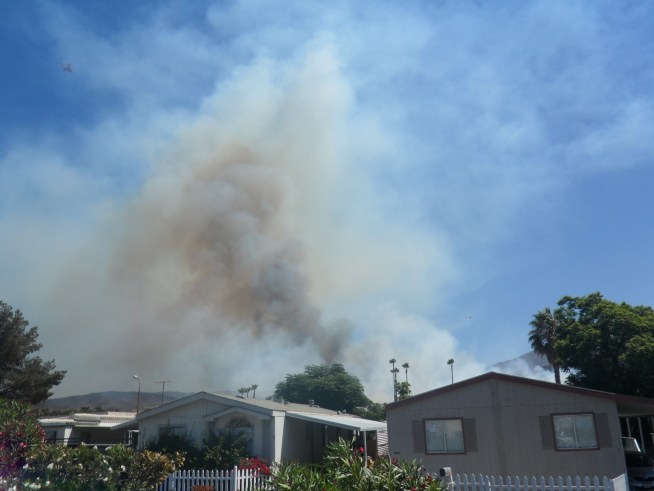 Flames came within yards of dozens of homes in <a title=