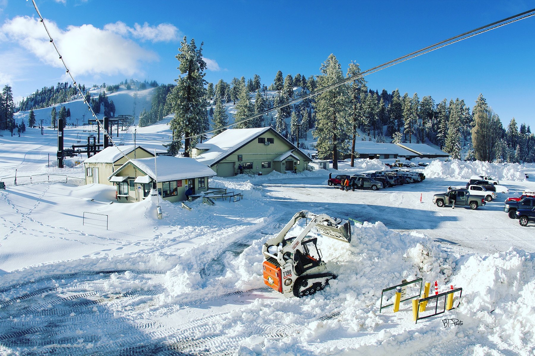 A machine shovels snow at the Snow Valley Mountain Resort in the San Bernardino Mountain community of Running Springs on Saturday, Jan. 21, 2017.