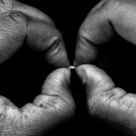 103119 grain of rice in hands