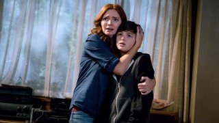 Brigid Brannagh as Rita Johnson and Logan Williams as Max Johnson in "Supernatural."