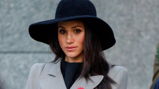 In this April 25, 2018, file photo, Meghan Markle, the US fiancee of Britain's Prince Harry, attends an Anzac Day dawn service at Hyde Park Corner in London, England.